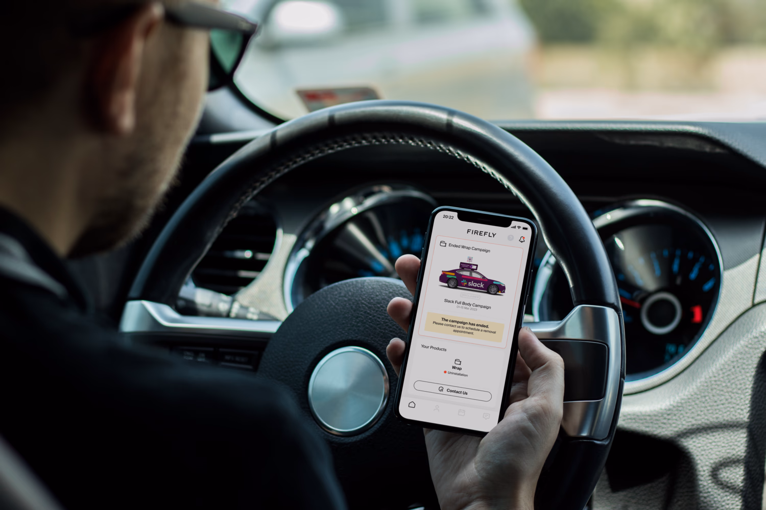 Driver checking the app in the car